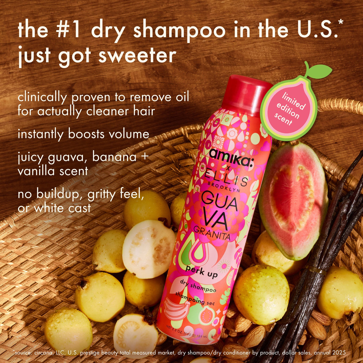 Amika Guava Granita dry shampoo bottle with guava slices and vanilla beans on a wooden bac