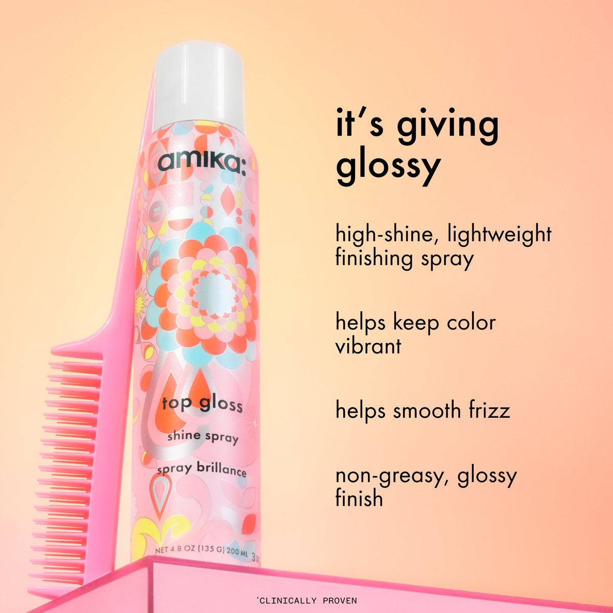 Amika hair spray with comb on a peach background