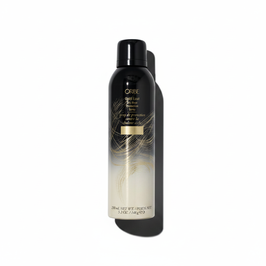 A spray bottle of Oribe Gold Lust Dry Heat Protection Spray