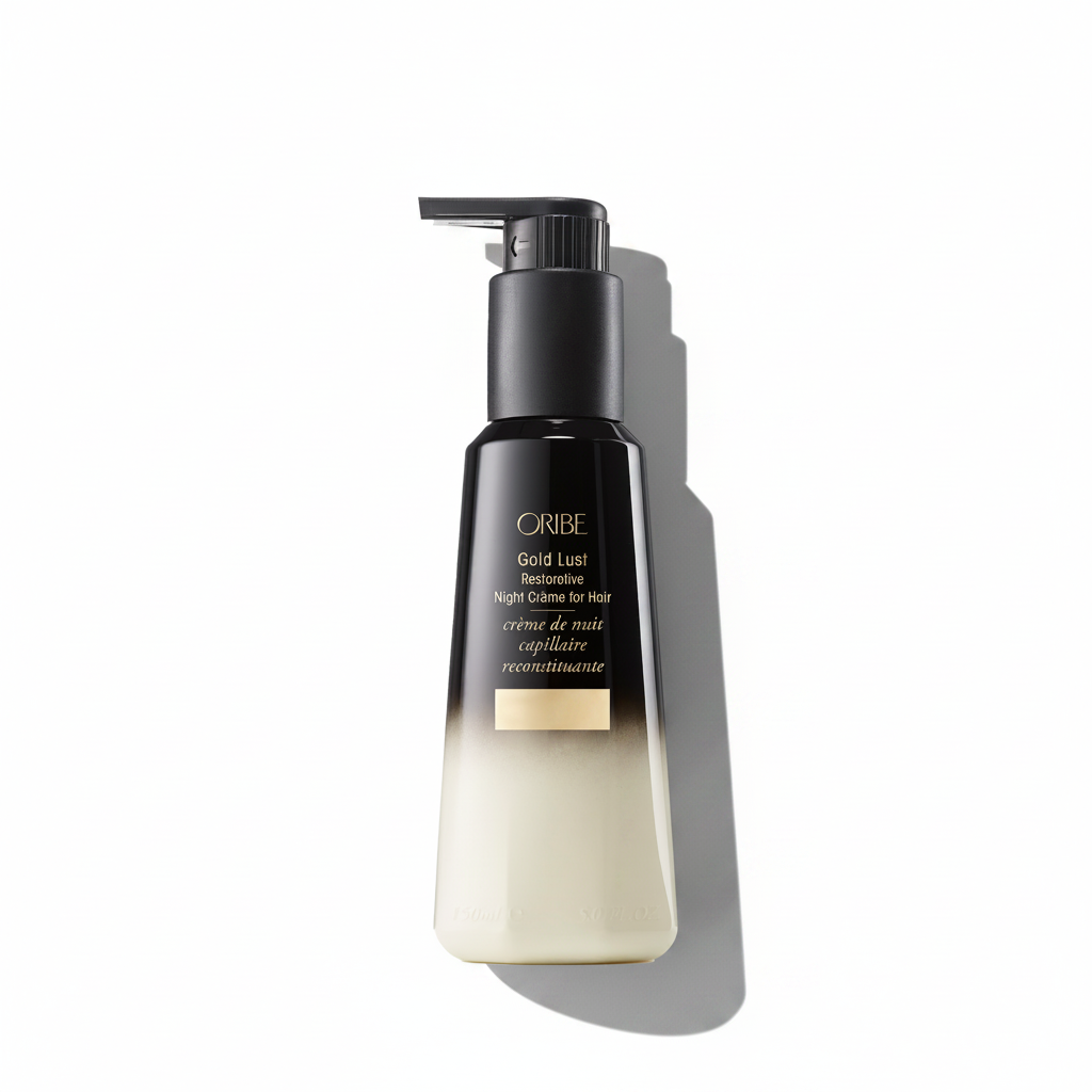 A pump bottle of Oribe Gold Lust Restorative Night Crème for Hair