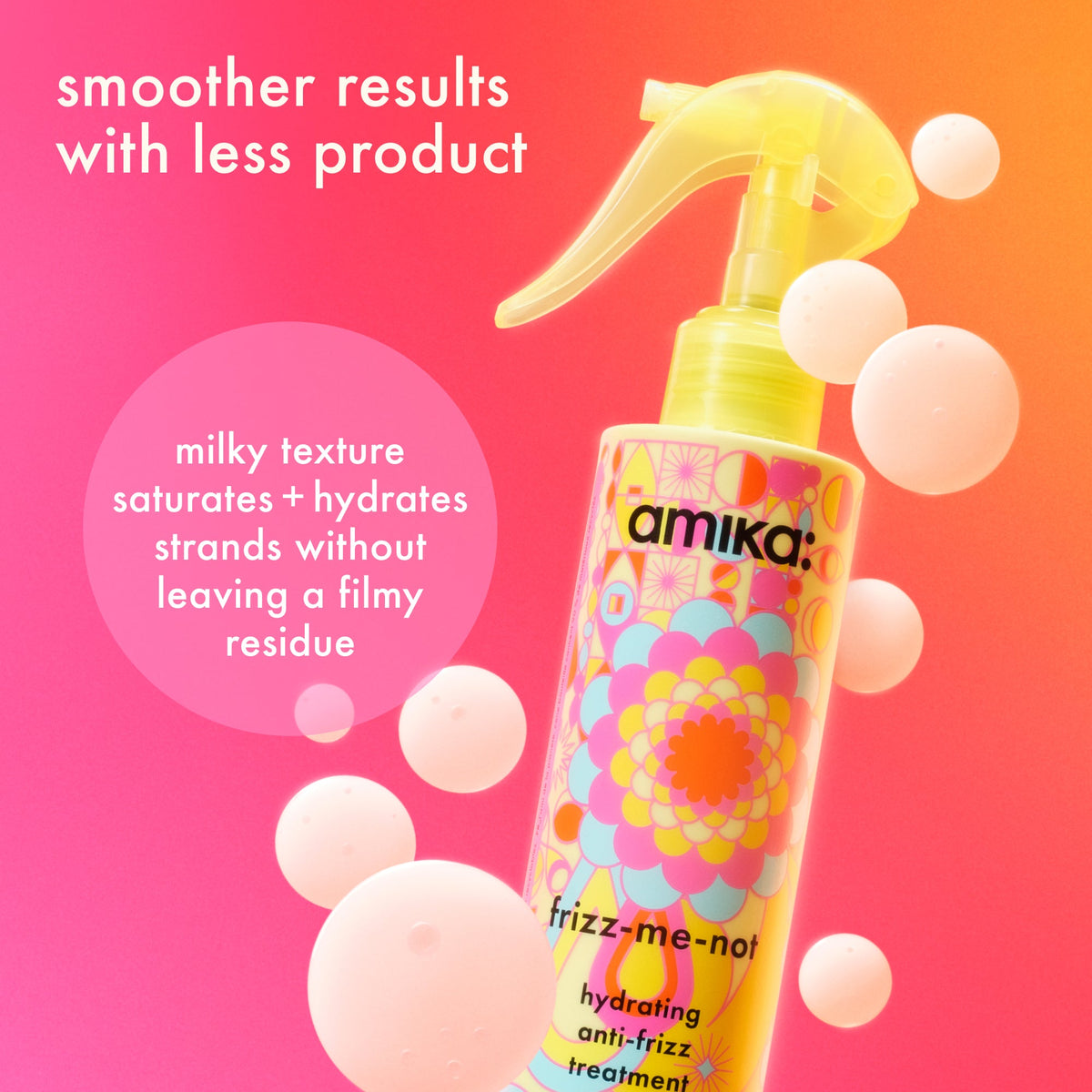 Amika frizz-me-noil hair product with colorful packaging on a pink and orange gradient bac