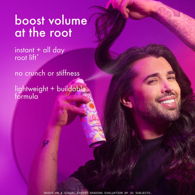 Man with long hair holding a can of hair product against a purple background. Text: "boost
