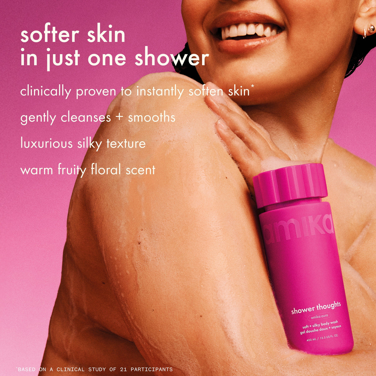 Person smiling while applying body wash to shoulder. shower thoughts softens skin in just 