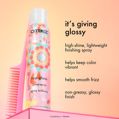 Amika hair spray with comb on a peach background