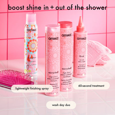 Amika hair care products on a pink tiled bathroom background