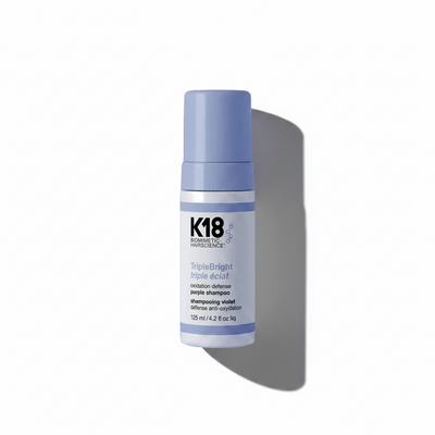 K18 Triple Bright purple shampoo bottle on a white background