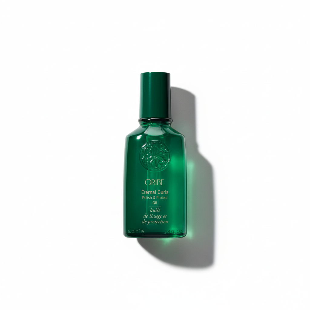 Green bottle of Oribe product on a white background