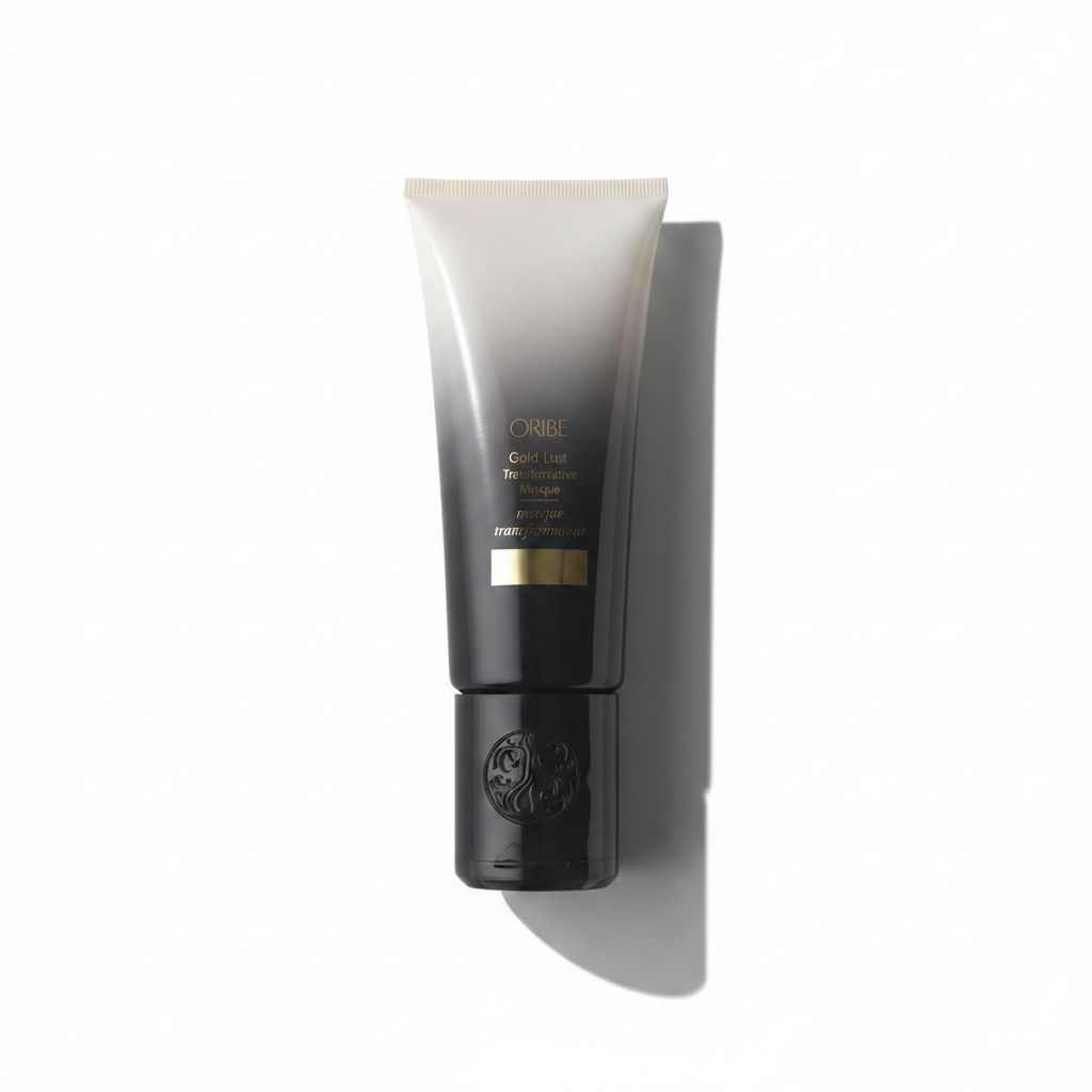 A tube of Oribe Gold Lust Transformative Masque hair conditioner against a white background.