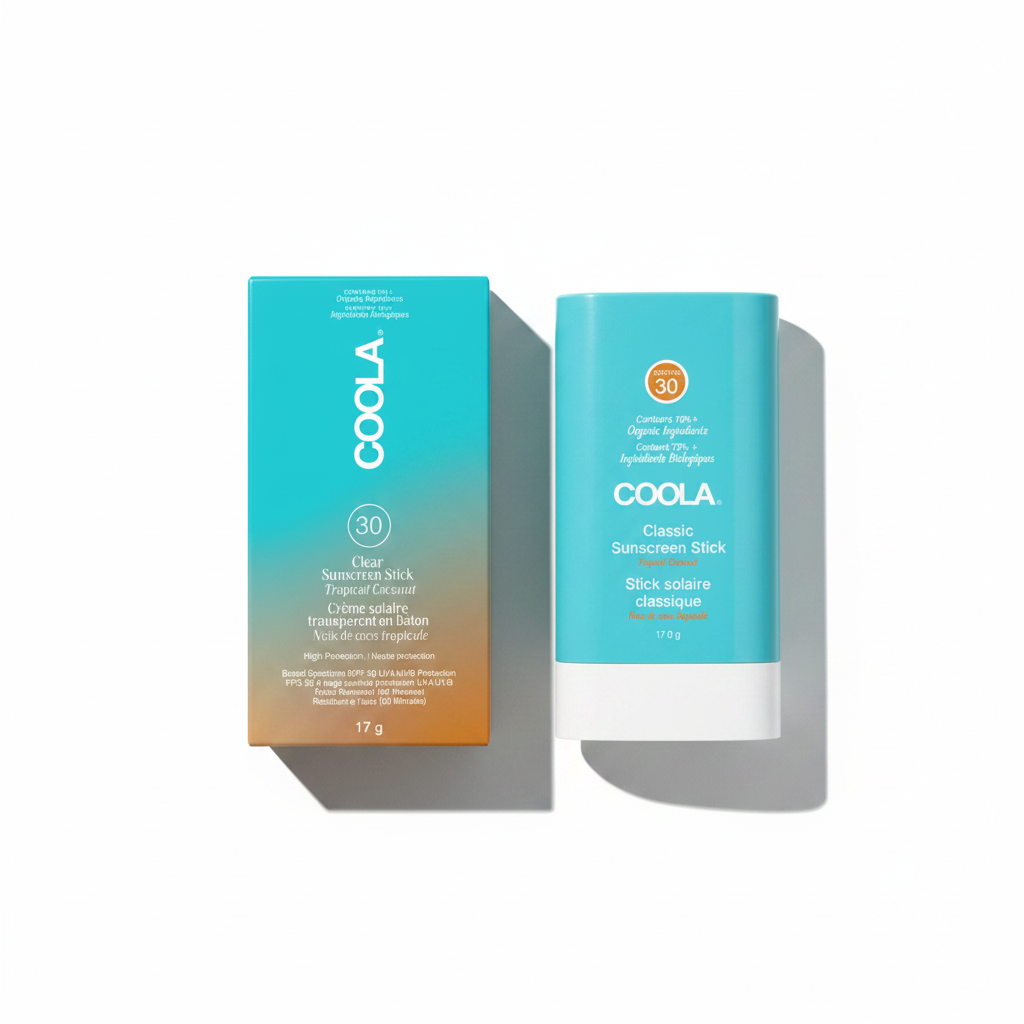 Two Coola sunscreen sticks on a white background