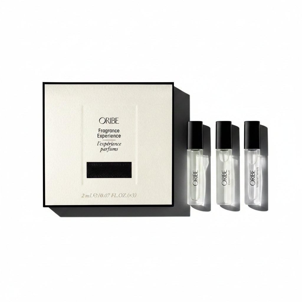 Oribe Fragrance Experience set with a box and three small bottles on a white background