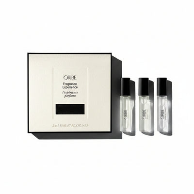 Oribe Fragrance Experience set with a box and three small bottles on a white background