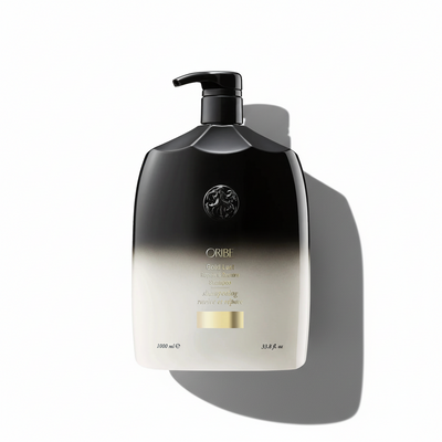 Oribe hair product bottle with gradient design on a white background
