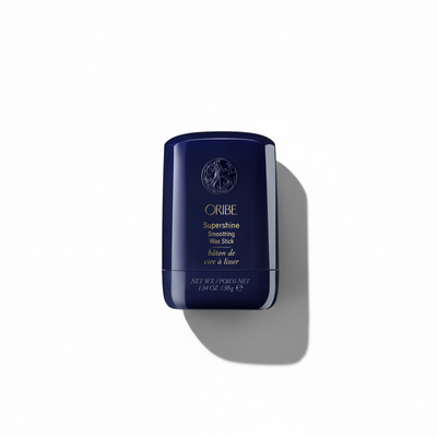 Oribe hair product stick on a white background