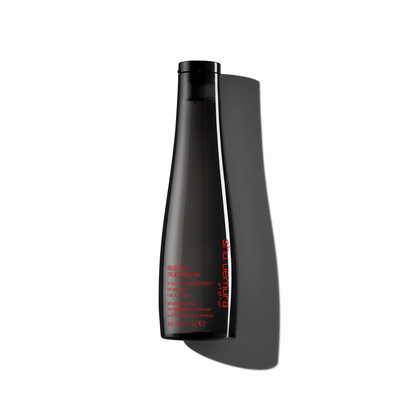 Black cylindrical bottle with red text on a white background