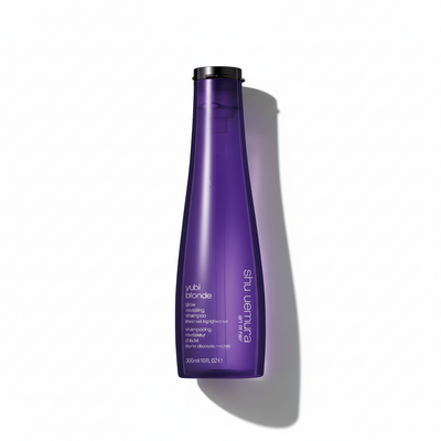 Purple shampoo bottle with black cap on a white background