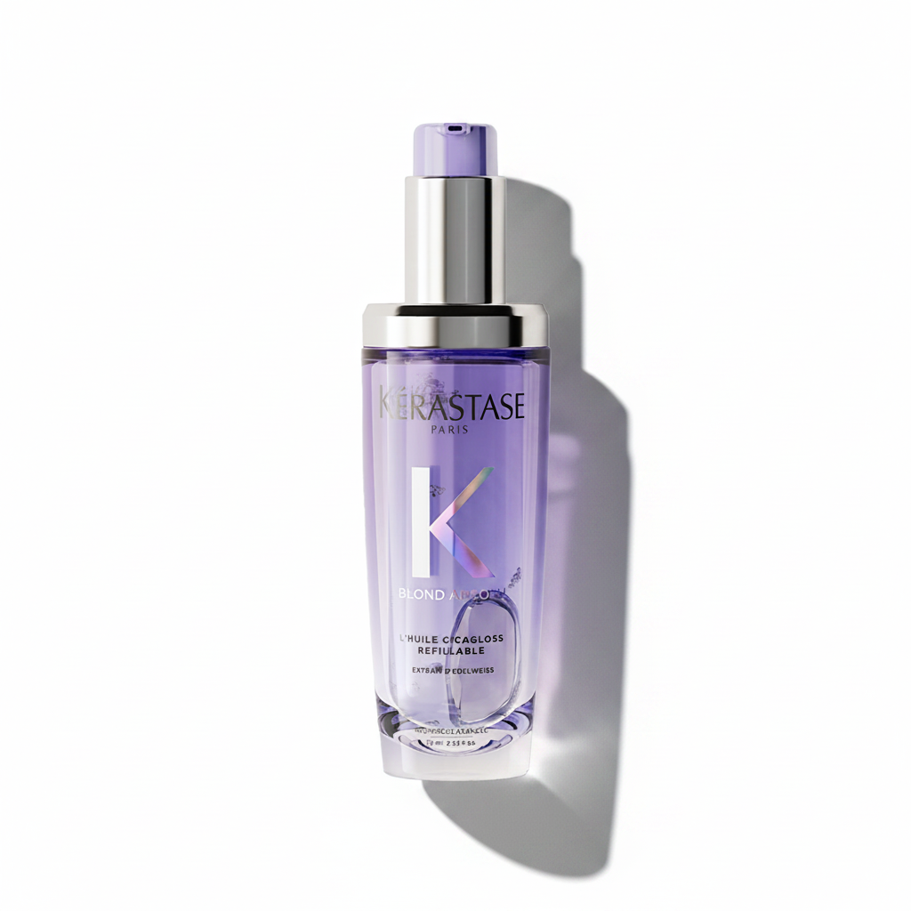 A pump bottle of Kerastase Blond Absolu Cicagloss Refillable Oil with a purple label and cap.